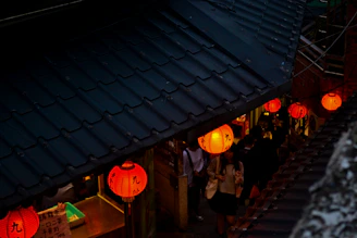 Dynamic shot of visitors exploring a dimly lit alleyway set up for the K-pop demon hunters tour experience.