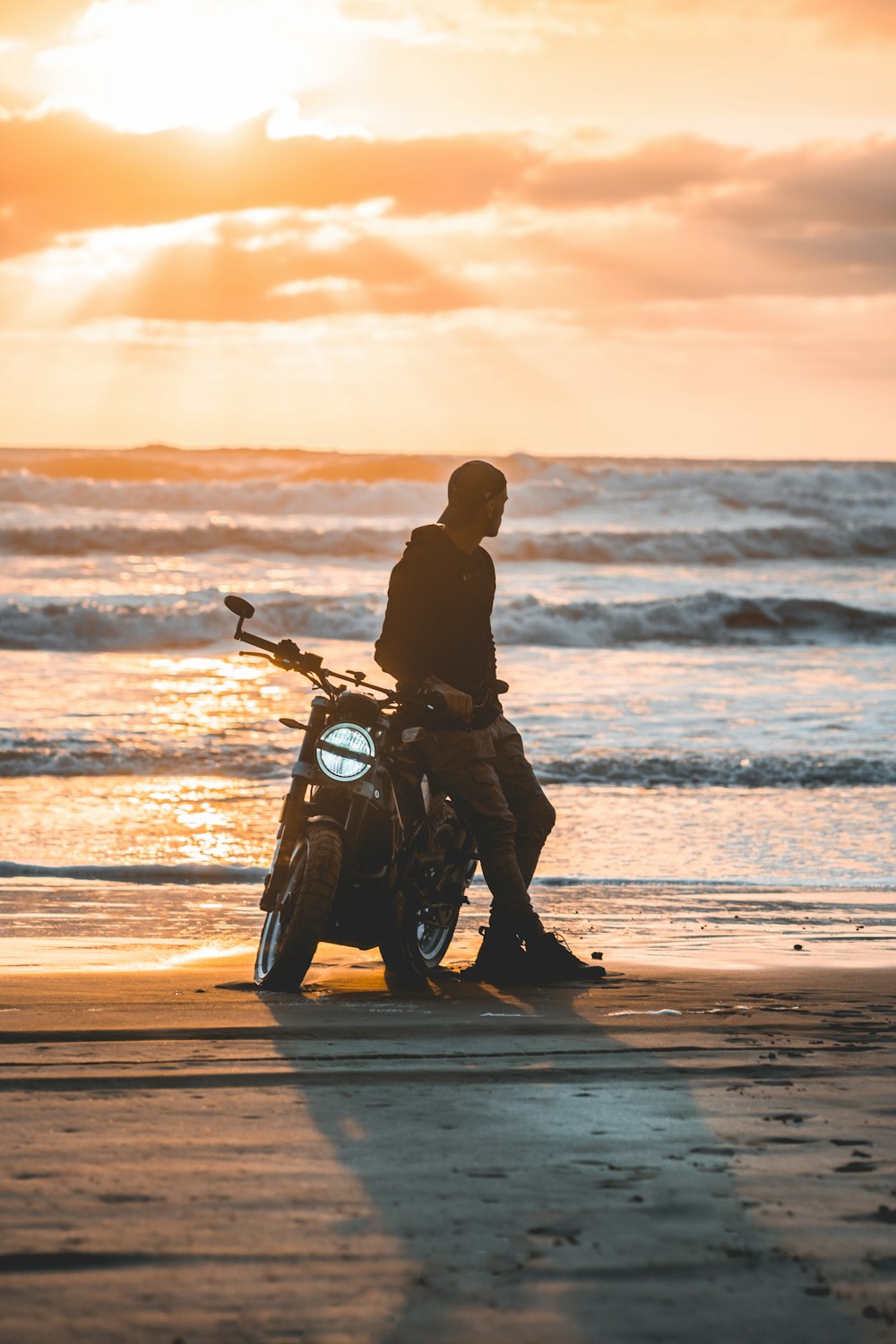 man sitting on motorcycle