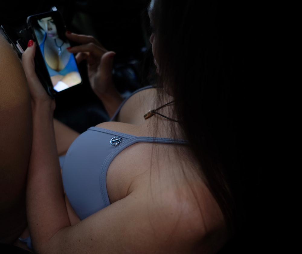 woman wearing blue bra