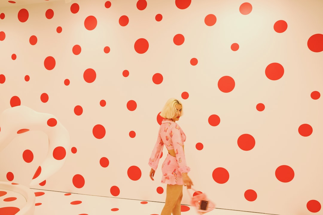 woman taking selfie, Artwork by Yayoi Kusama