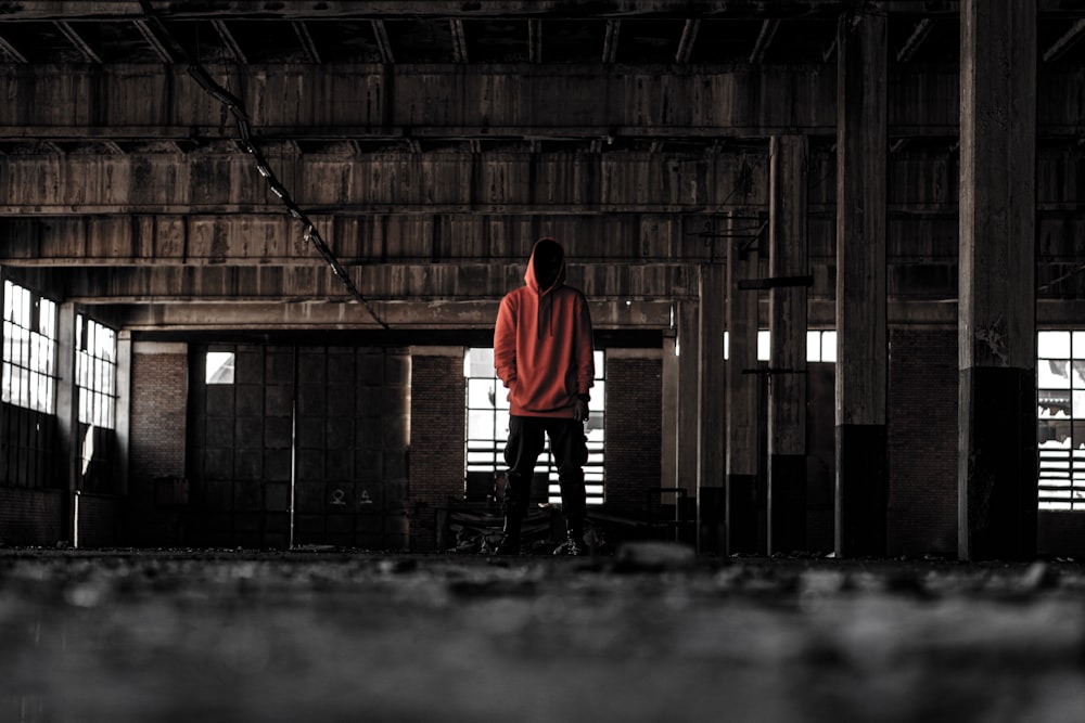 person standing inside abandoned building