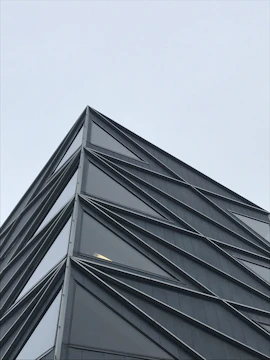 A commercial building under construction featuring bold geometric shapes.