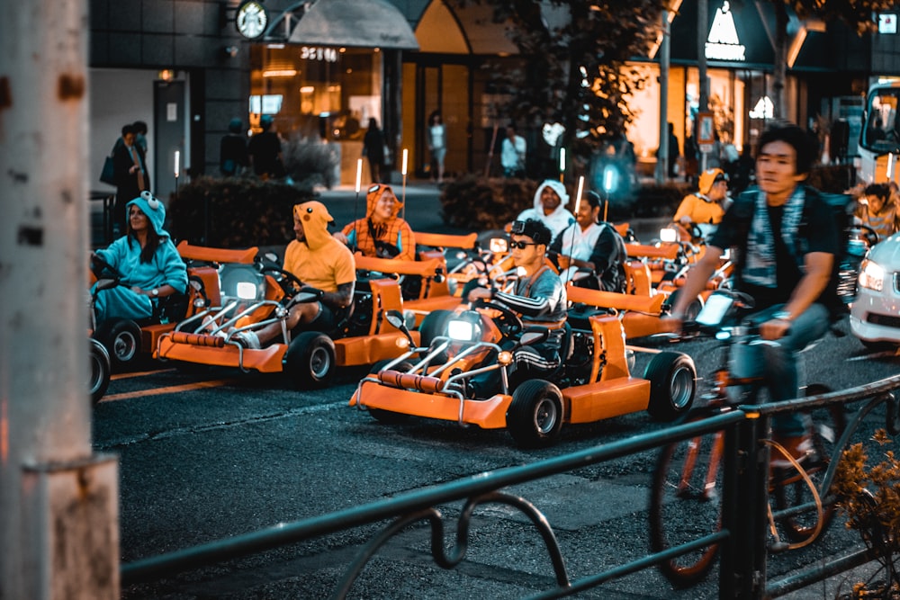 people riding go-karts