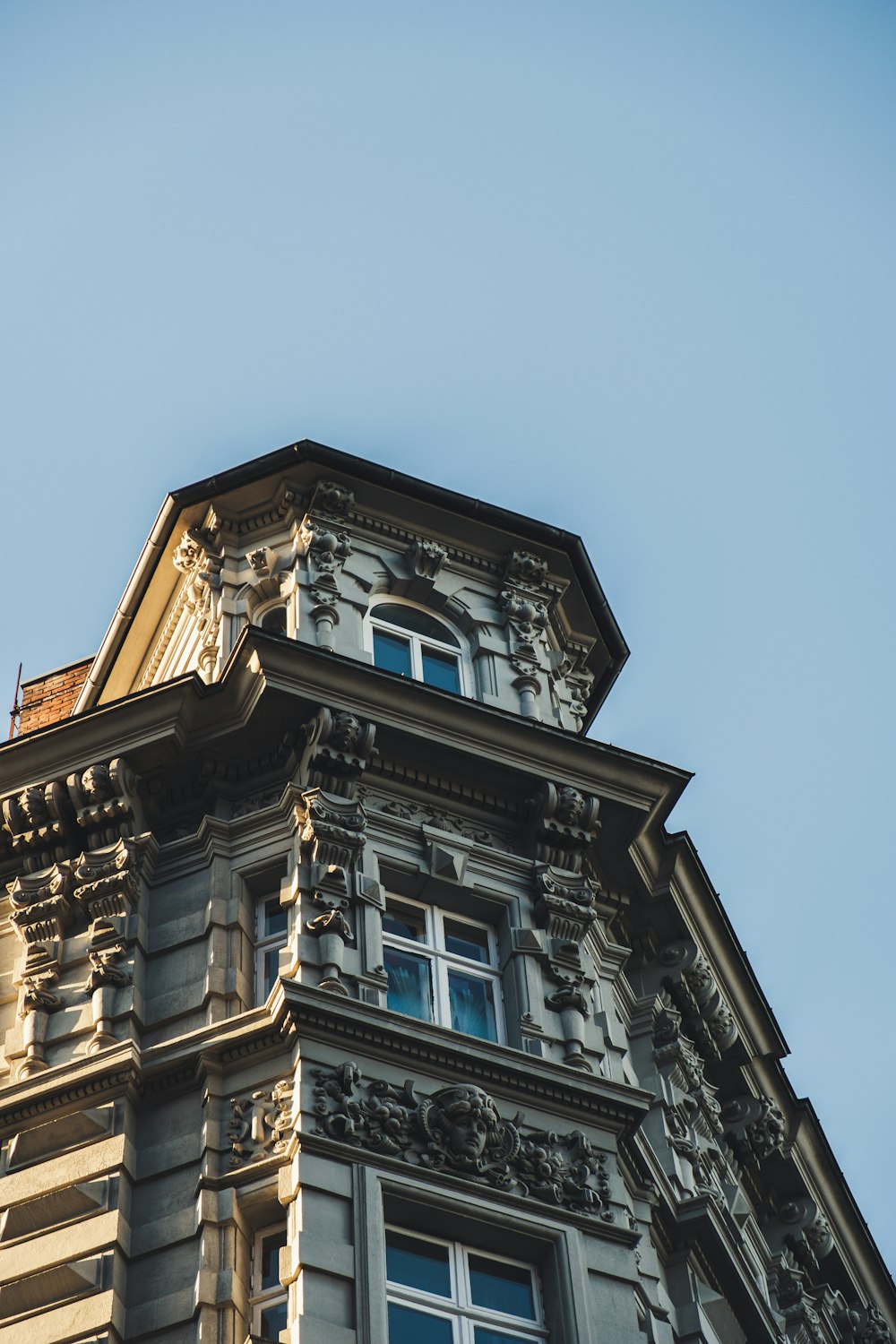 low-angle photography of brown concrete building during daytime