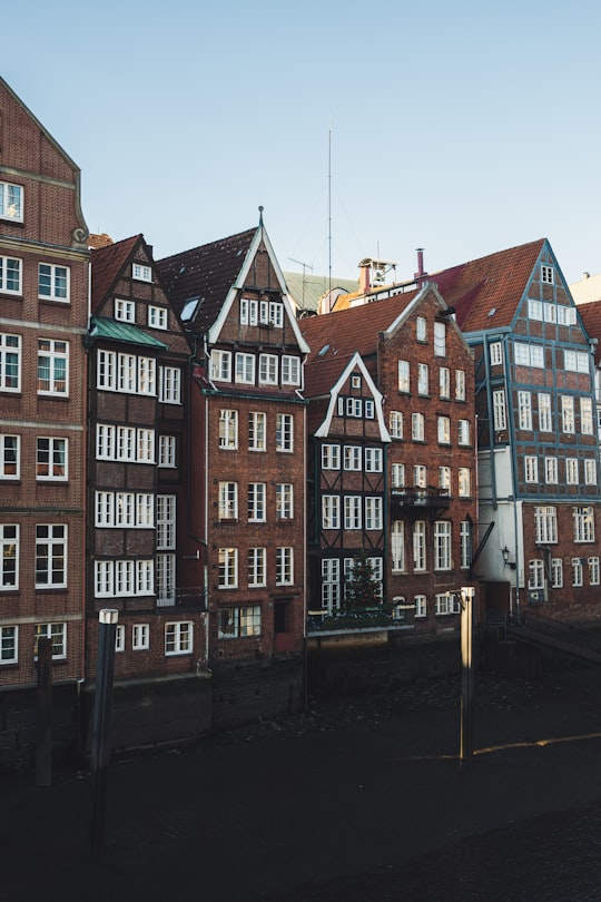 brown and black concrete buildings during daytime in Nikolai Fleet Germany