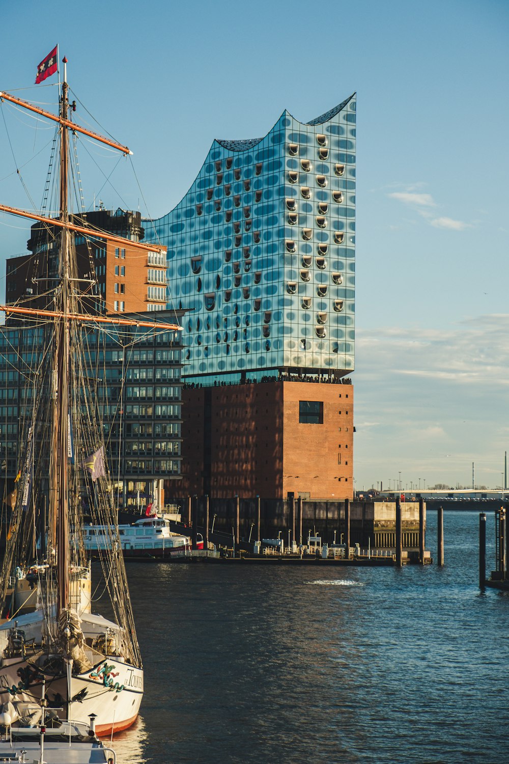 a tall building next to a body of water