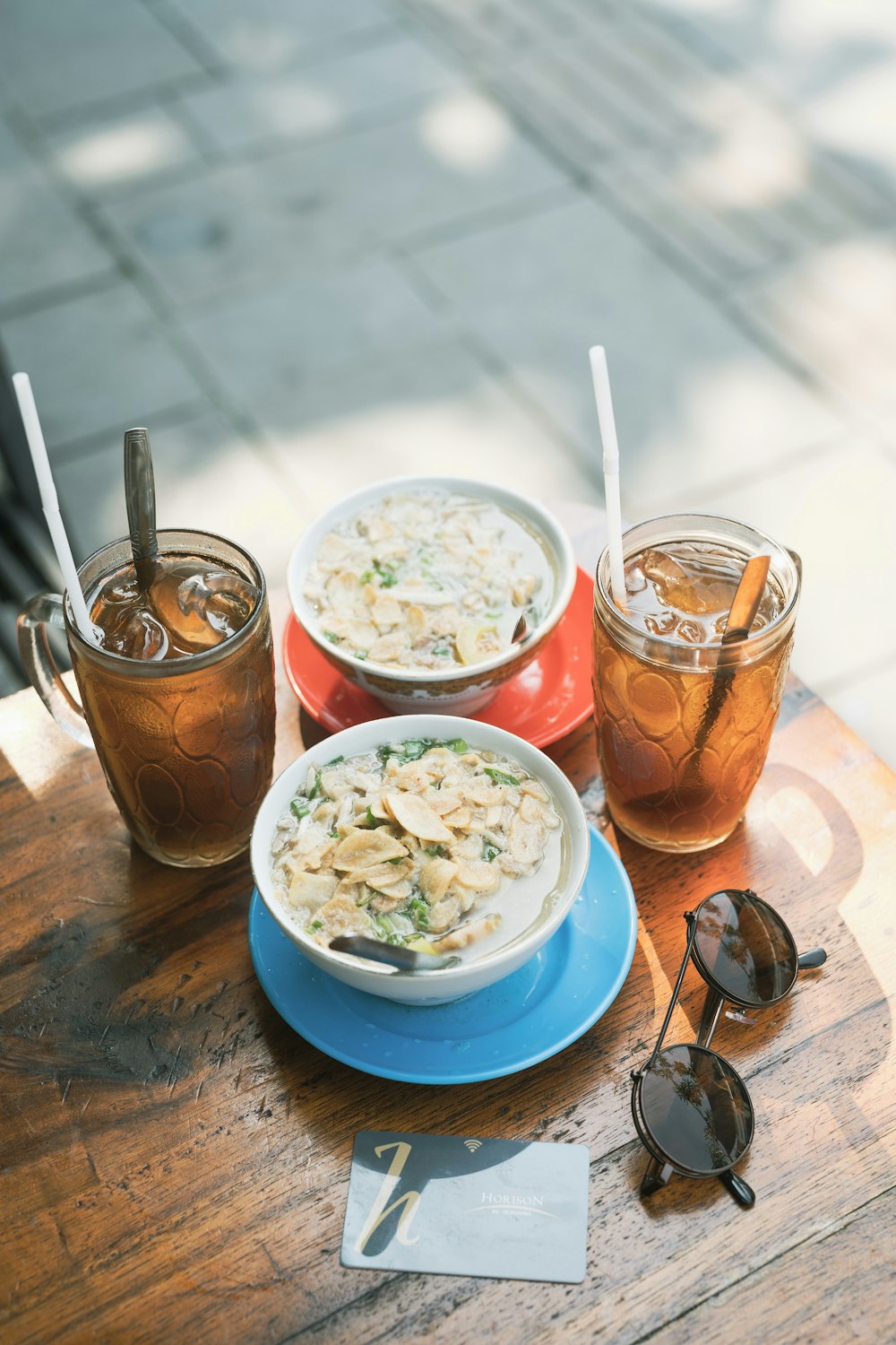 selective focus photography of two bowl of soup with drinks on table