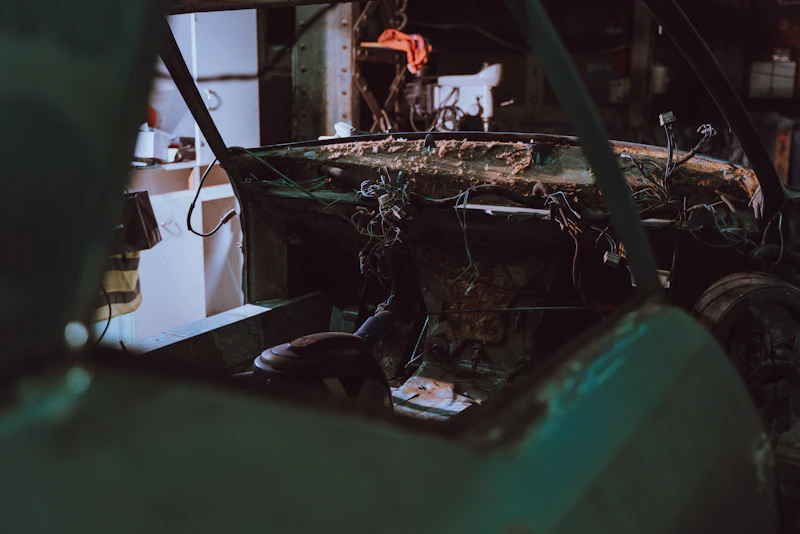 Person fixing an unfinished car