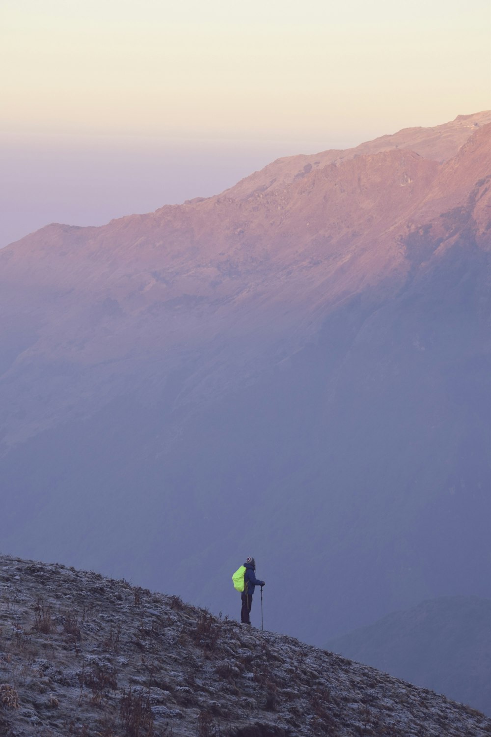 person carrying camping backpack during daytime