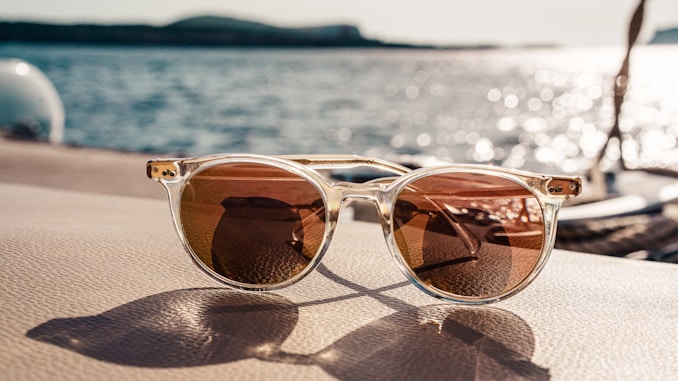 white framed brown lens sunglasses