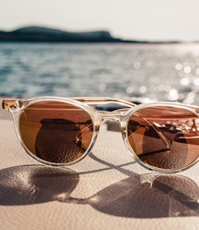 white framed brown lens sunglasses