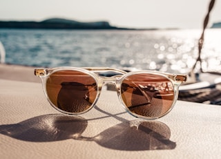 white framed brown lens sunglasses