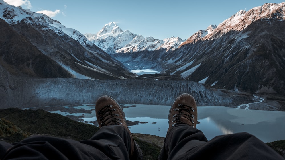 person taking picture of mountain