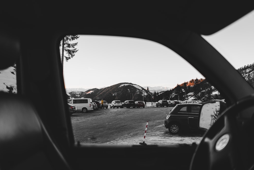 a view of a parking lot from inside a car