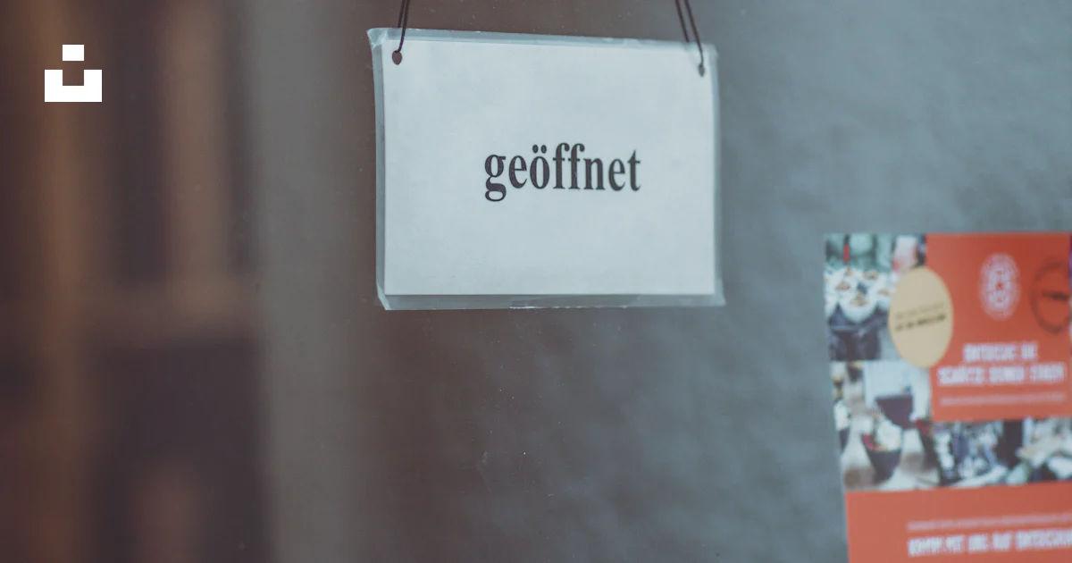 Geoffnet Postmark Geoffnet sign hanging by the window photo – Free Grey Image on Unsplash