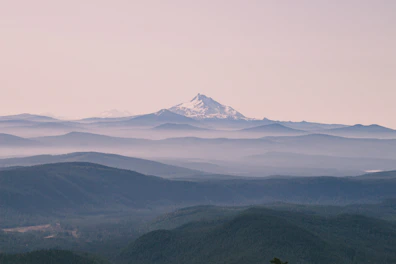 Canvas landscape wall art featuring a serene mountain scene with soft pastel colors.