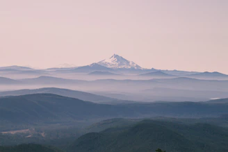 Canvas landscape wall art featuring a serene mountain scene with soft pastel colors.