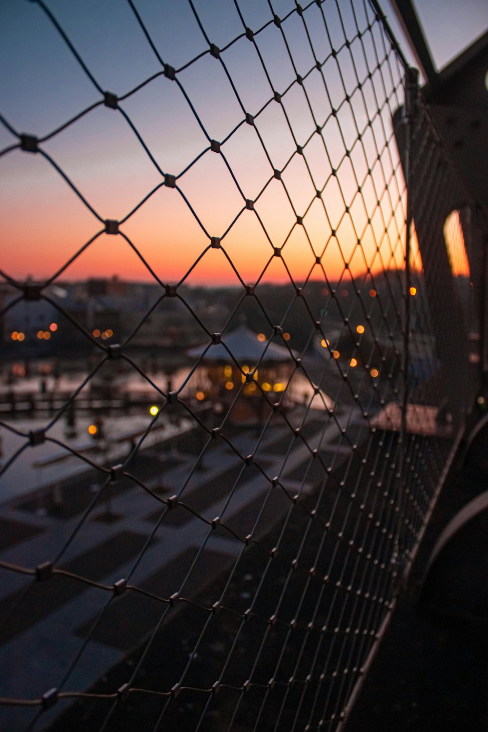 shallow focus photo of cyclone fence