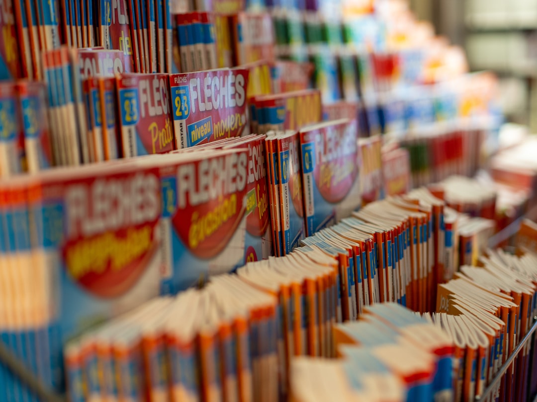 Fleches books displayed on rack