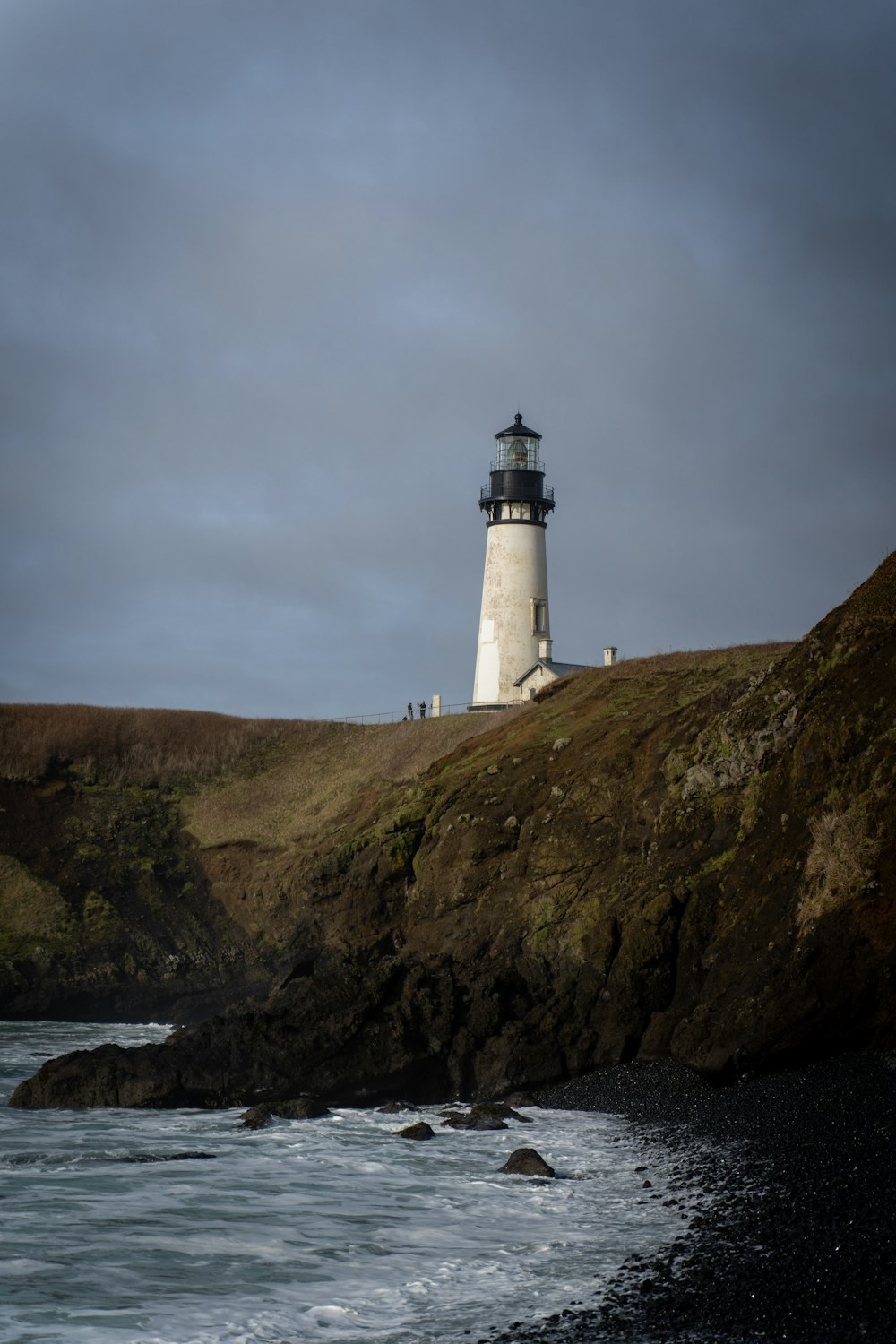 white and black lighthouse photograph