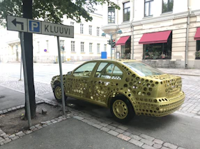 Exterior view of Motoex Oy autokorjaamo in Turku with clear signage and cars parked outside