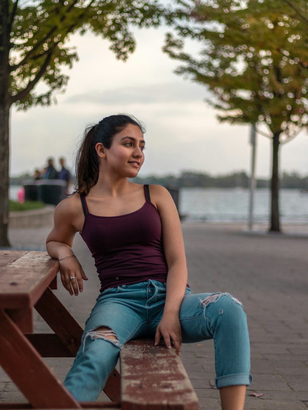 woman sitting on picnic table