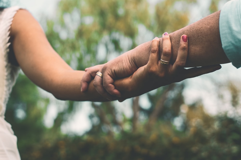 woman and man holding hands