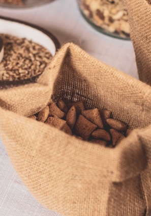 shallow focus photo of brown sack on white surface