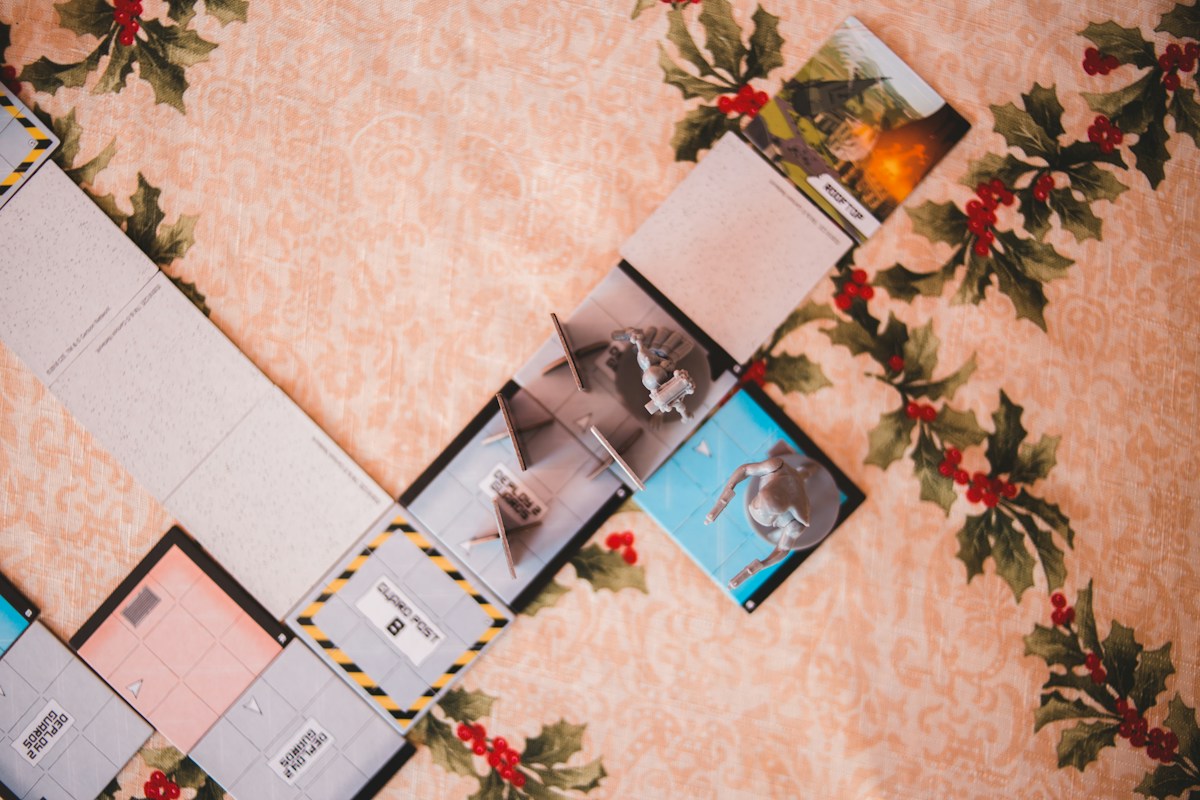 Photos on a table surrounded by Christmas decorations, ideal for youth group Christmas party planning ideas.