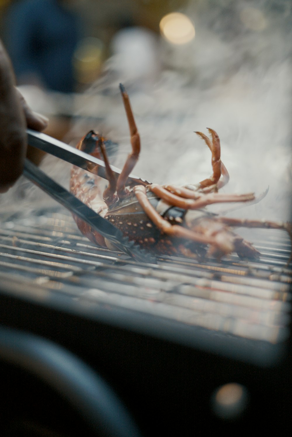 a person is grilling some food on a grill