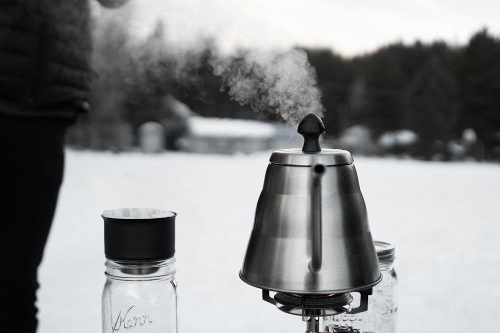 grayscale photography of smoke coming out from a kettle