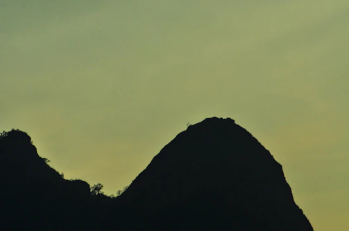 A simple silhouette of Spain's map in soft green tones, with a subtle outline for a personal photo spot