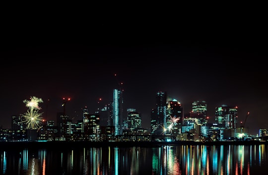 lighted city buildings during nighttime in Greenwich United Kingdom