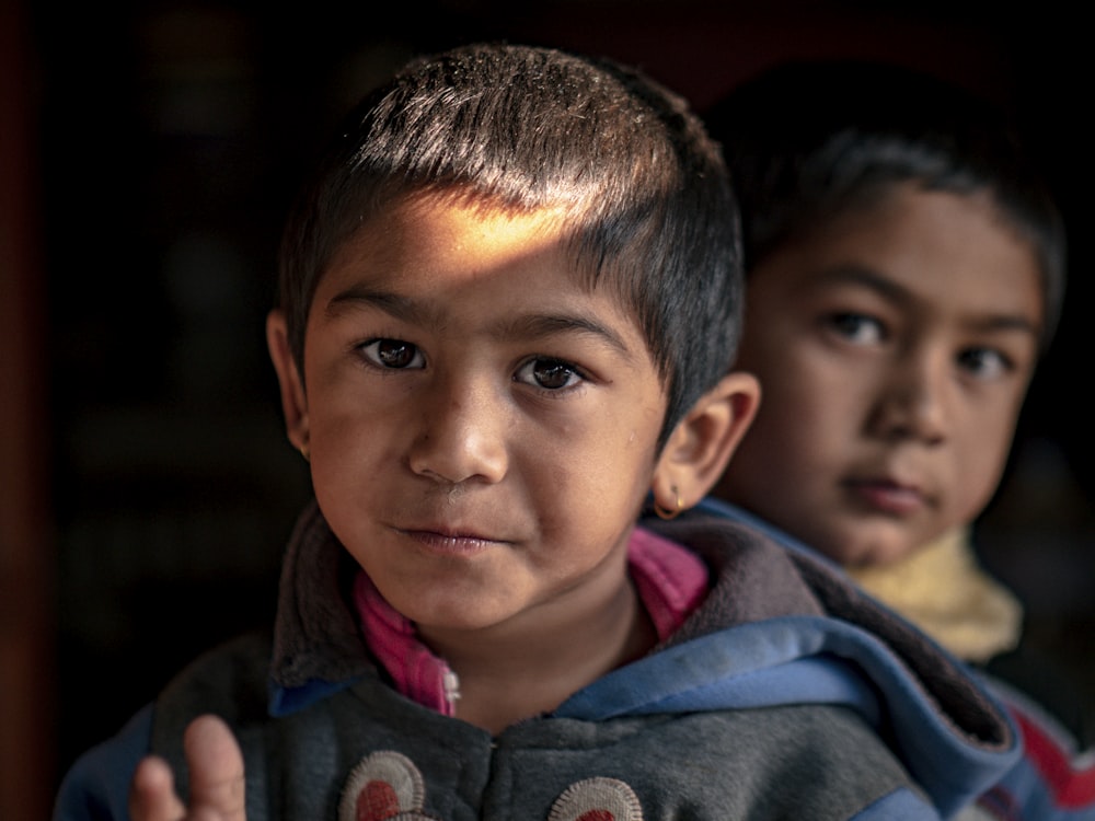 two boys looking at the camera