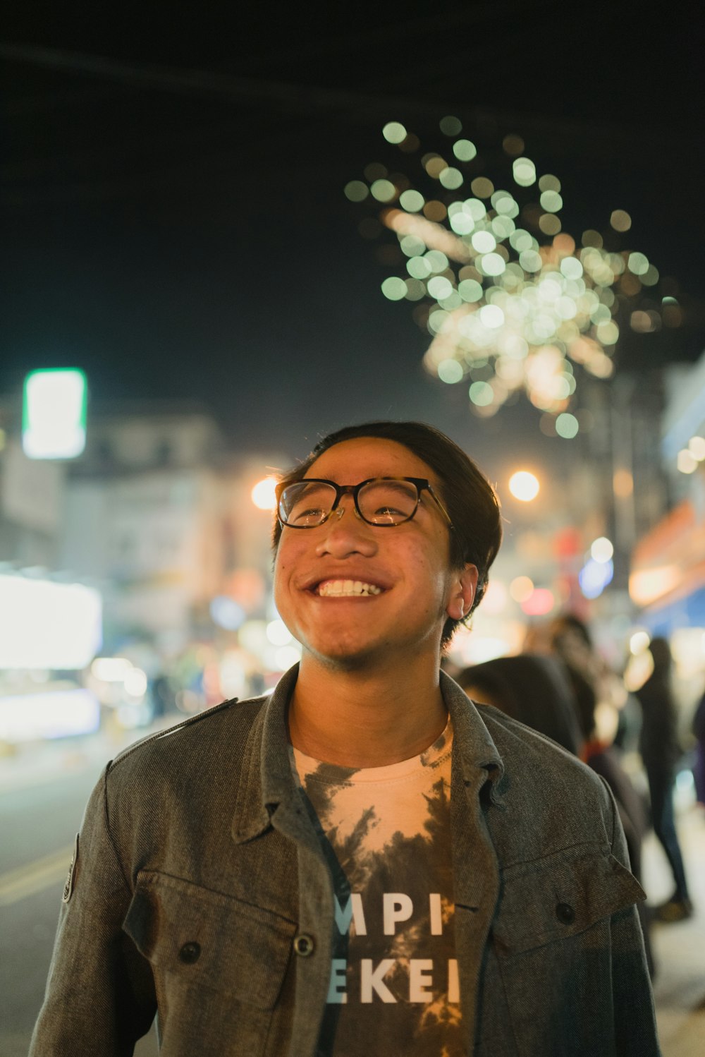 smiling man wearing black frame eyeglasses