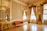 Close-up of a luxurious vinyl floor with elegant gold accents in a modern living room.