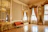 Close-up of a luxurious vinyl floor with elegant gold accents in a modern living room.
