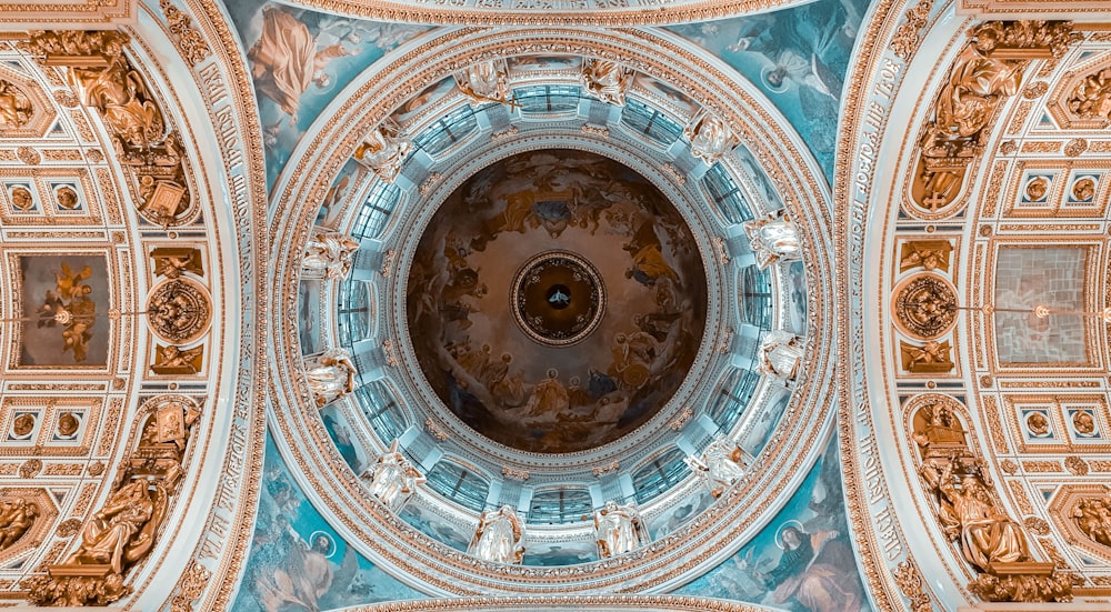 the ceiling of a building with a dome in the center