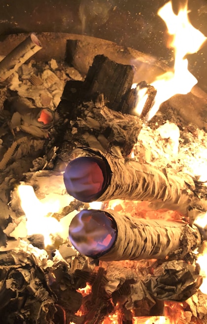 Smoke swirling over a firepit at dusk in the Brazilian cerrado