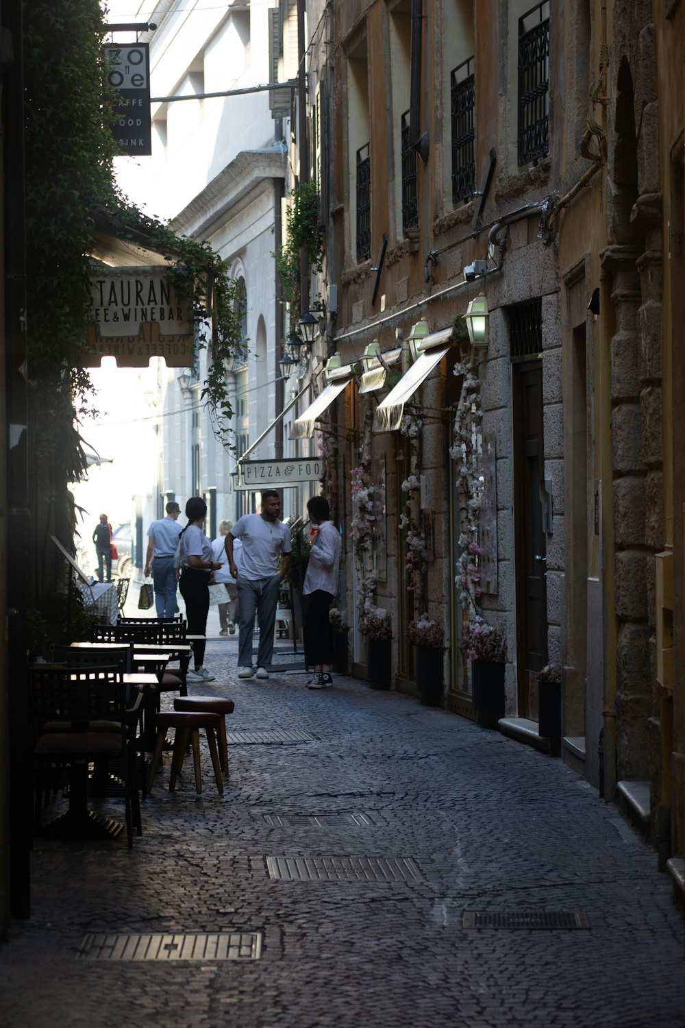 people between buildings during day