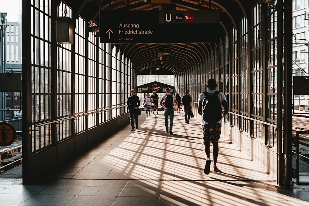 people passing by inside tunnel