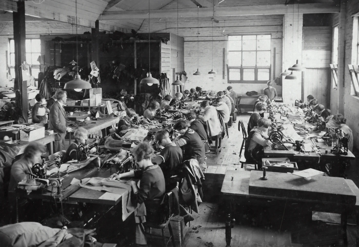 Quality inspector checking trouser measurements before packing