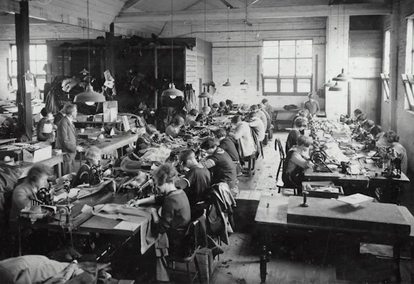 Workers inspecting fabric on the factory floor