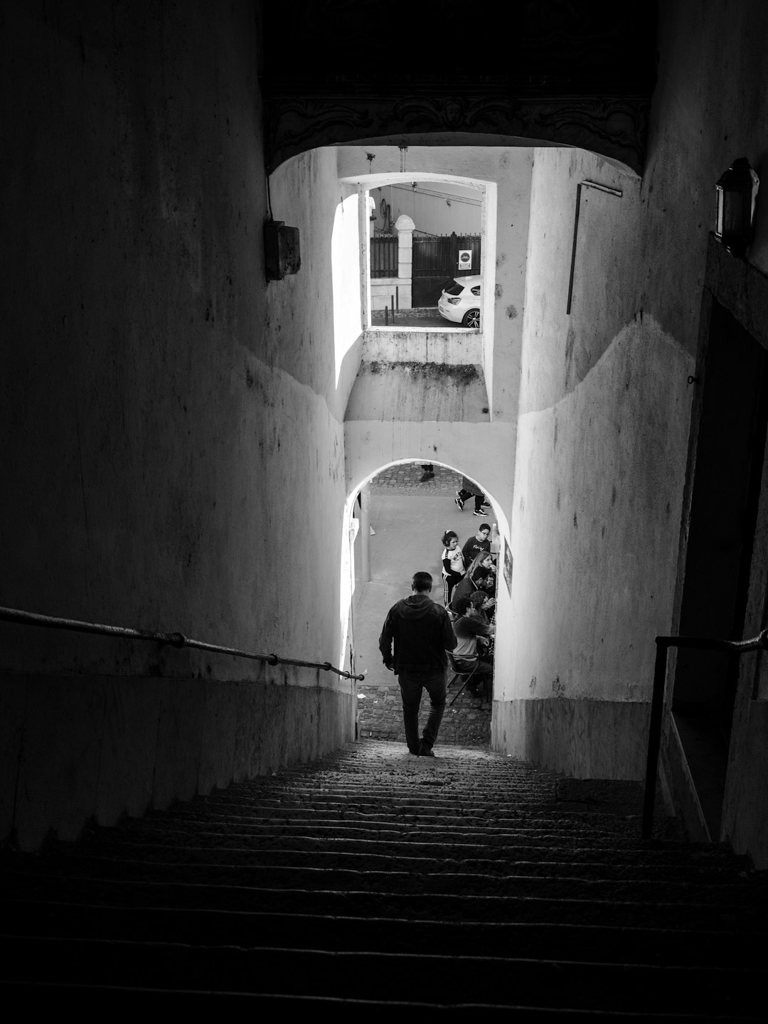 man walking down the tunnel stairs