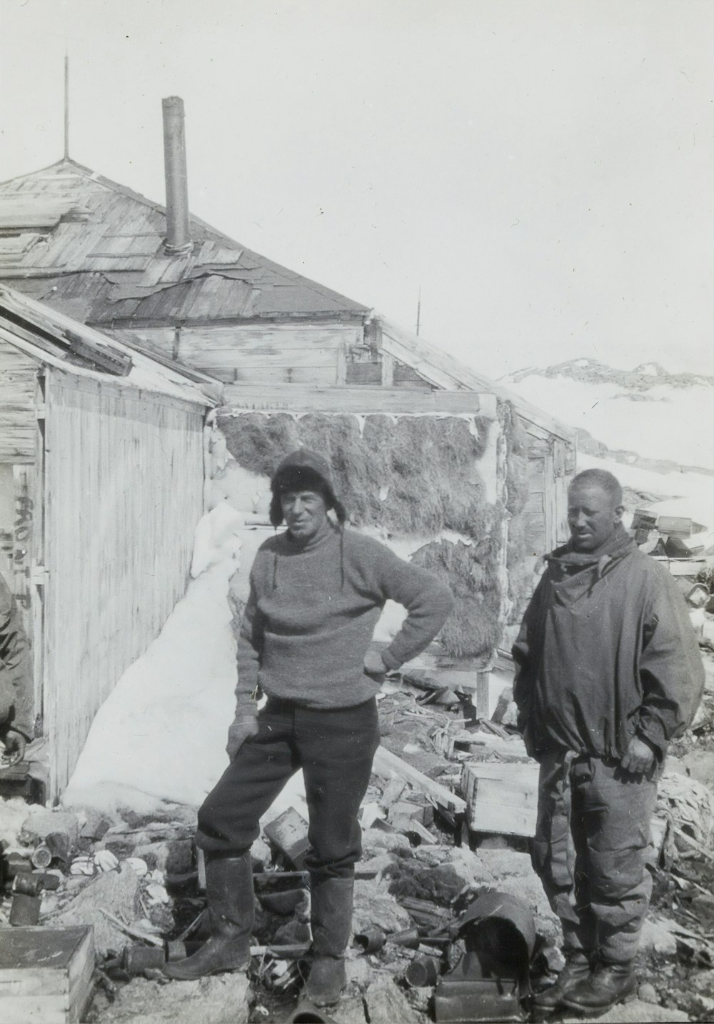 two men standing near building