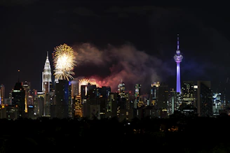 Awards ceremony showing happy winners lifting trophies with the city skyline behind them