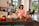 man, woman, and two boys inside kitchen