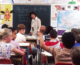 woman standing in front of children