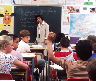 woman standing in front of children