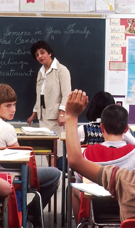 woman standing in front of children